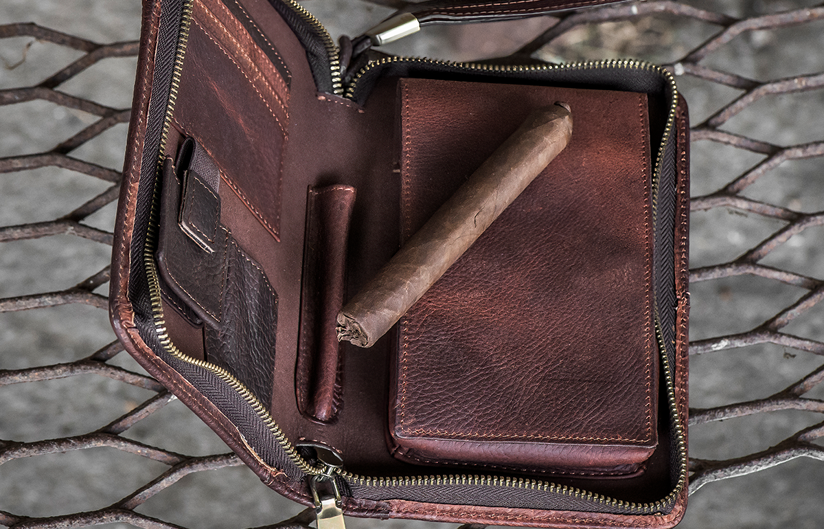 Cole Wheeler cigar travel carry case on iron grate